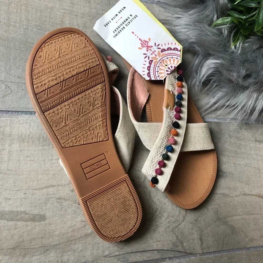 NWT! Tom’s kids’ bohemian Pom Pom sandals. Size 2